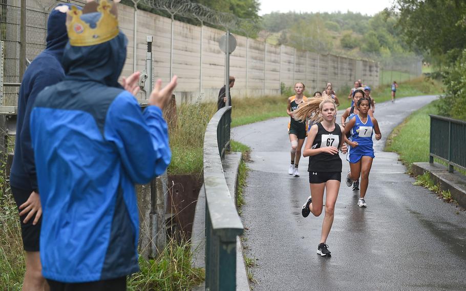 Stuttgart runner Isabella Cope leads a group of runners on their first lap of girls the 3.1-mile cross country race at Vilseck, Germany, Saturday, Sept. 10, 2022.