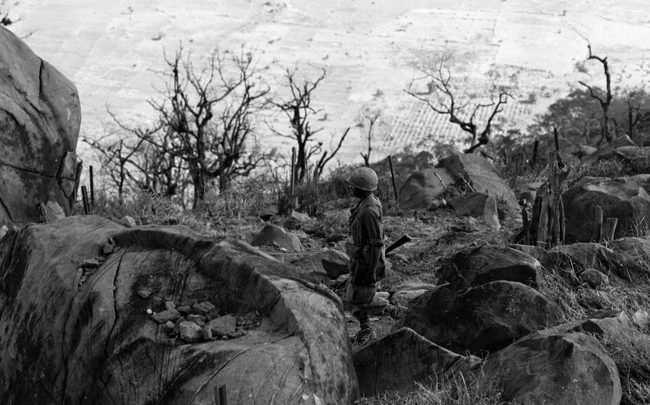 A soldier walks atop Black Virgin Mountain