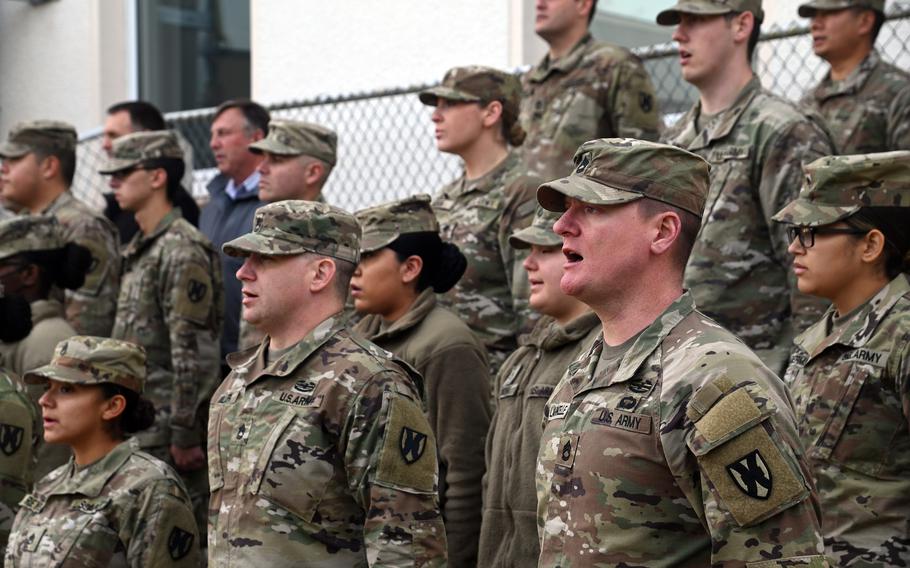 Soldiers sing “The Army Song” at the end of the 21st Theater Sustainment Command’s Veterans Day observance at Panzer Kaserne in Kaiserslautern, Germany, on Nov. 10, 2021. In honor of veterans, all six service songs were played.