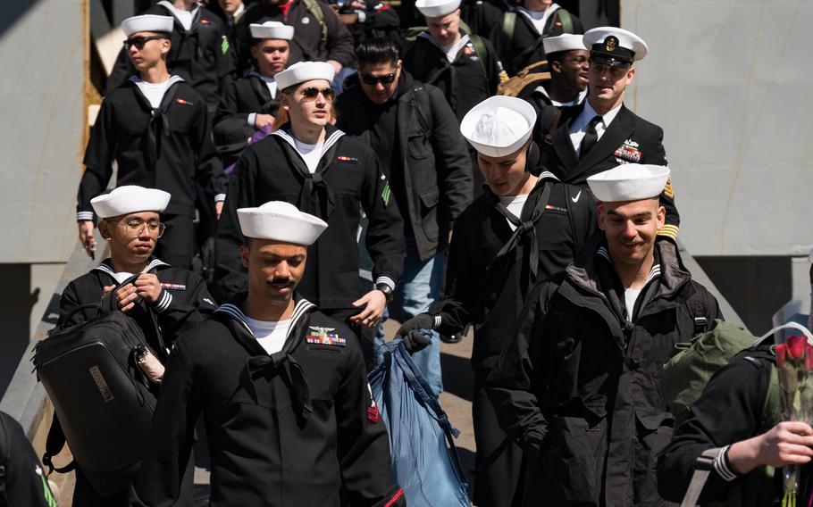 Sailors depart the Wasp-class amphibious assault ship USS Bataan (LHD 5), assigned to the Bataan Amphibious Ready Group (ARG), after Bataan returned to Naval Station Norfolk, Thursday, March 21, 2024.