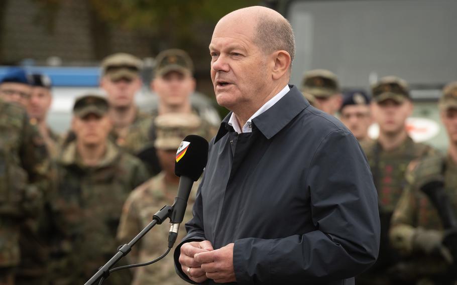 German Chancellor Olaf Scholz speaks to German and American troops following an exercise Oct. 23, 2023, at a military base outside Cologne, Germany.