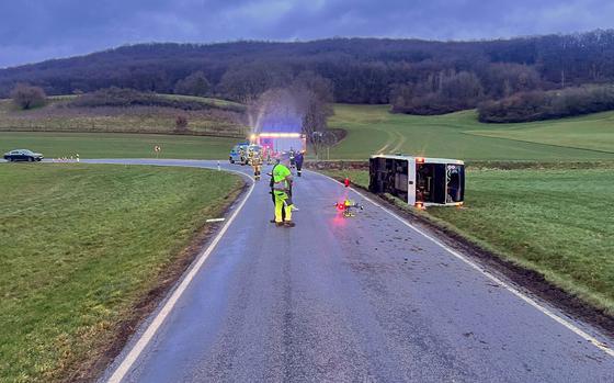A DODEA-contracted school bus is overturned March 10, 2023, near Weilerbach Germany. Thee bus was carrying about 15 students. One student was taken to Landstuhl Regional Medical Center with minor injuries, authorities at the Weilerbach firehouse said.