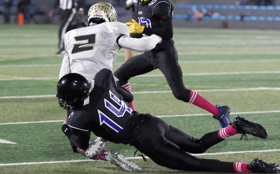 Osan's Jaylon Grant drags down Humphreys Black's Sean Cook.