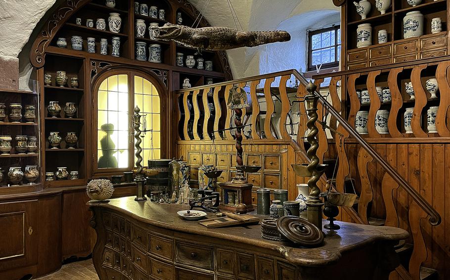 This room is a recreation of the officina for the Court Pharmacy of Bamberg in the Germany Pharmacy Museum in Heidelberg, Germany. The officina, or the Latin word for workshop, includes Baroque furnishings such as the preparation table from around 1730 to 1740.