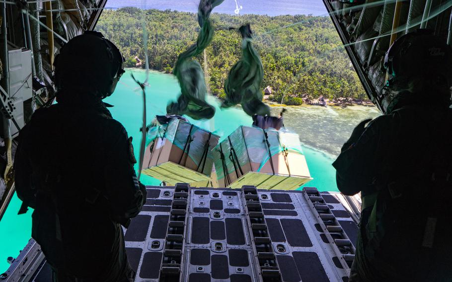 Royal New Zealand Air Force loadmasters release bundles of supplies to a Micronesian island during Operation Christmas Drop in 2019. 