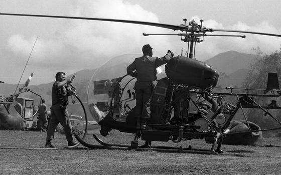 Bong Son, Feb. 2, 1966: Ground crewmen prepare to refuel a Scout H-13 helicopter at Bong Son, Republic of Vietnam, during the 1st Air Cav. Div.'s participation in Operation White Wing. Flying "low and slow," the “Scout” H-13’s of the 1st Squadron, 9th Cavalry, are almost totally exposed to anyone shooting at them as they sit in their plastic bubble.

Read about the Scouts, their pilots in the 1966 article accompaning the photo here.

Looking for Stars and Stripes’ coverage of the Vietnam War? Subscribe to Stars and Stripes’ historic newspaper archive! We have digitized our 1948-1999 European and Pacific editions, as well as several of our WWII editions and made them available online through https://starsandstripes.newspaperarchive.com/

META TAGS: combat; Vietnam War; war; helicopter; landing zone; resupply; Scout; Operation Masher; Operation White Wing; 1st Squadron, 9th Cavalry,