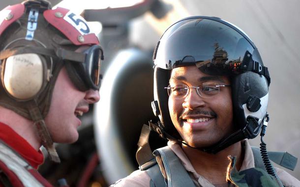 Hed: Post-Prowling chat, 2003

Mar. 22, 2003: After a flight in a Prowler, Lt. Silas "Shibaz" Bouyer, right, 26, a naval flight officer from Detroit, smiles while chatting with a flight deck sailor. The crew of USS Kitty Hawk provied close air support for ground troops in southern Iraq and jamming radar in the skies in support of coalition aircraft. 

META TAGS: Operation Iraqi Freedom; Wars on Terror; U.S. Navy; aircraft carrier; USS Kitty Hawk