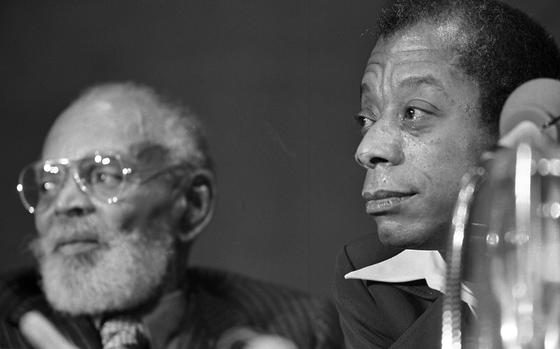 Stuttgart, Germany, Feb. 16, 1973: Authors Chester Himes (left) and James Baldwin (middle) at the “Black Literature Night” and "Discussion of the Racial Situation in America and Europe"at the Liederhalle in Stuttgart, February 16, 1973. Himes is the author the noir Harlem Detective series of novels as well as several politcal works on the Black experience in the United States. Several of his books have been adapted to the big screen, including his first novel "If He Hollers Let Him Go" (1968), "Cotton Comes to Harlem" (1970) and "A Rage in Harlem" (1990).

RELATED:
From the Archives: Viewpoint: Chester Himes https://www.stripes.com/news/from-the-s-s-archives-viewpoint-chester-himes-1.17016.

From the Archives: Viewpoint: James Baldwin. https://www.stripes.com/news/viewpoint-james-baldwin-1.17013 

META TAGS: Europe; West Germany; African American; Black; author; literature; culture; DODDS: DODEA: students; education