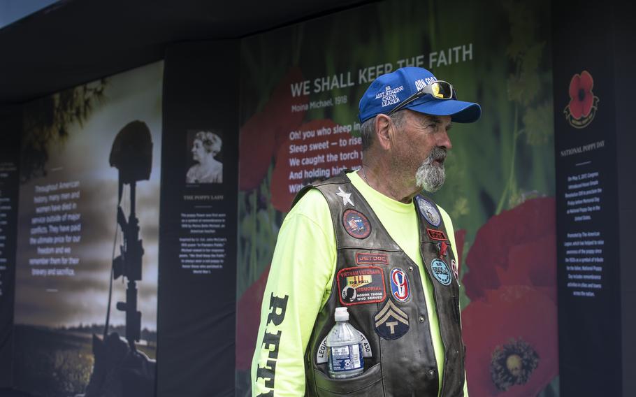 Air Force veteran Jim Hilderbrand walks through the USAA Poppy Wall of Honor on Saturday, May 28, 2022, in Washington D.C.