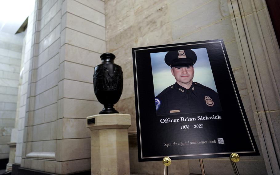 A sign outside the Rotunda memorialized U.S. Capitol Police Officer Brian D. Sicknick, 42, who died the day after engaging rioters during the Capitol attack.