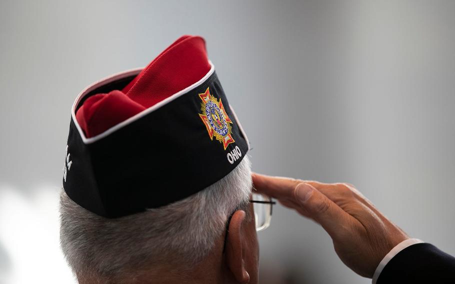 Bill Tate of Westerville salutes the flag Friday at the induction ceremony for the Ohio Military Hall of Fame for Valor class of 2021.