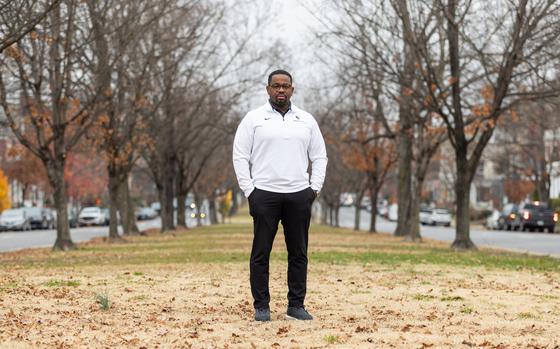 Devon Henry stands near the former site of the Robert E. Lee statue, which his company was hired to remove, on Monument Avenue in Richmond on Dec. 6. MUST CREDIT: Photo for The Washington Post by Parker Michels-Boyce.