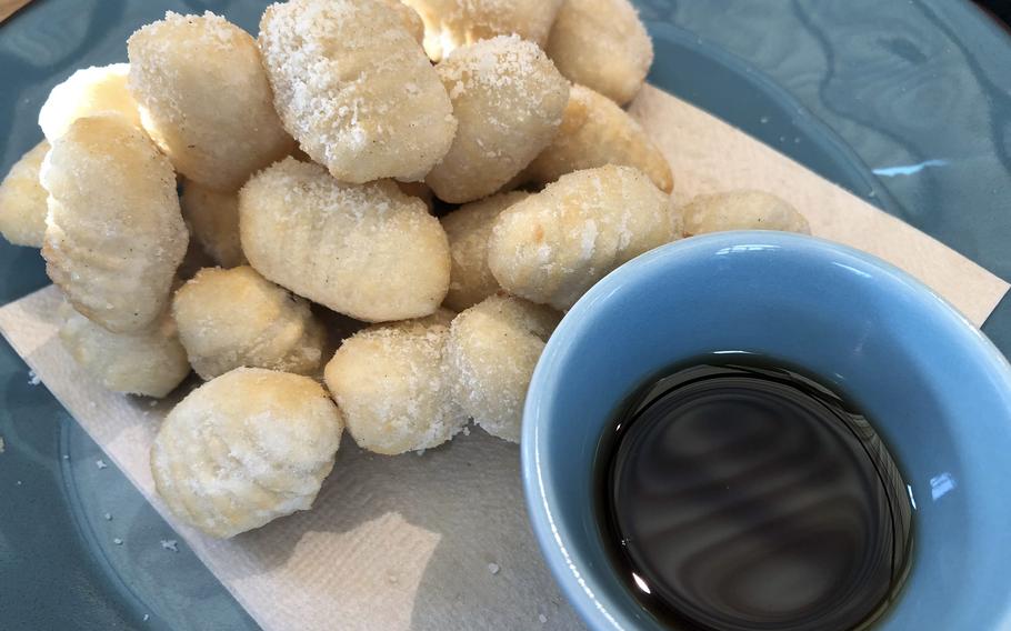 Fried gnocchi with a side of maple syrup from Pisola in Fussa, Japan.