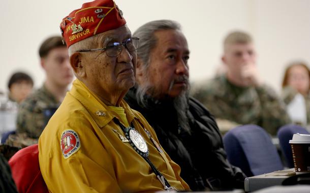 Navajo code talker Thomas Begay, left, listens to a speech given by Brig. Gen. Matthew Glavy, aboard Marine Corps Air Station Cherry Point, N.C., Jan. 17, 2017. Glavy and Begay spoke to Marines assigned to Marine Unmanned Aerial Vehicle Squadron 2, Marine Aircraft Group 14, 2nd Marine Aircraft Wing, in regards to the past, present and future of the Marine Corps. Glavy is the 2nd MAW commanding general. (U.S. Marine Corps photo by Cpl. Jason Jimenez/ Released)