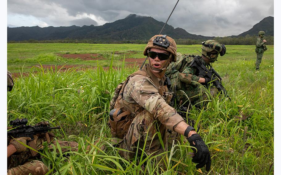 1st Lt. Kenneth Brown, Platoon Leader, C Troop, from the 2nd Squadron, 14th Cavalry Regiment, 2nd Infantry Brigade Combat Team calls out to his soldiers during a simulation fire exercise for Tiger Balm 23 at Schofield Barracks, Hawaii, on May 16, 2023. Jerimiah Richardson/U.S. Army