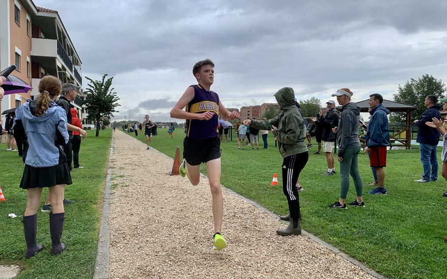 Strong thunderstorms in Naples, Italy, caused a four-hour delay of Saturday's DODEA cross country race and left runners to contend with rainy, muddy conditions.