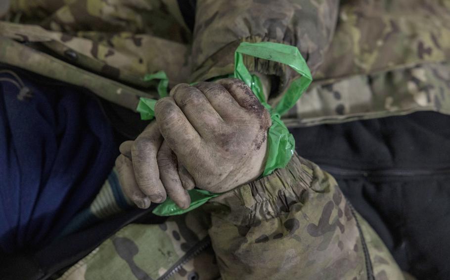 Mikhail, a captured fighter from Russia’s Wagner mercenary group, with his hands bound with tape on Monday. The Washington Post is not showing the captives’ faces or disclosing their surnames to protect them from reprisal. 