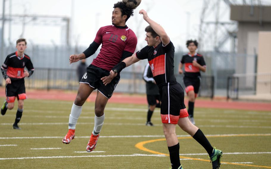 Matthew C. Perry's Denzel Gray heads the ball againsts E.J. King's Jacob Ferrer during Friday's Perry Cup soccer matches. The Samurai won 2-0.