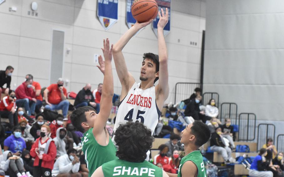 Lakenheath's Gabriel Stephenson goes up for a shot against SHAPE on Friday, Feb. 24, 2022, at the DODEA-Europe Division I basketball championships.