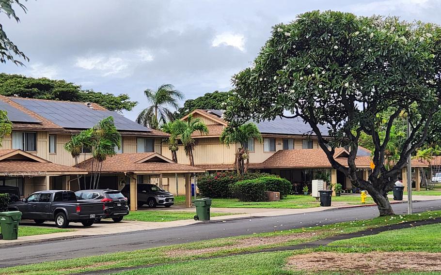 Duplex homes line a street in Earhart Village, one of five neighborhoods at Joint Base Pearl Harbor-Hickam, Hawaii, that make up Hickam Communities, which is operated by the Australia-based firm Lendlease.