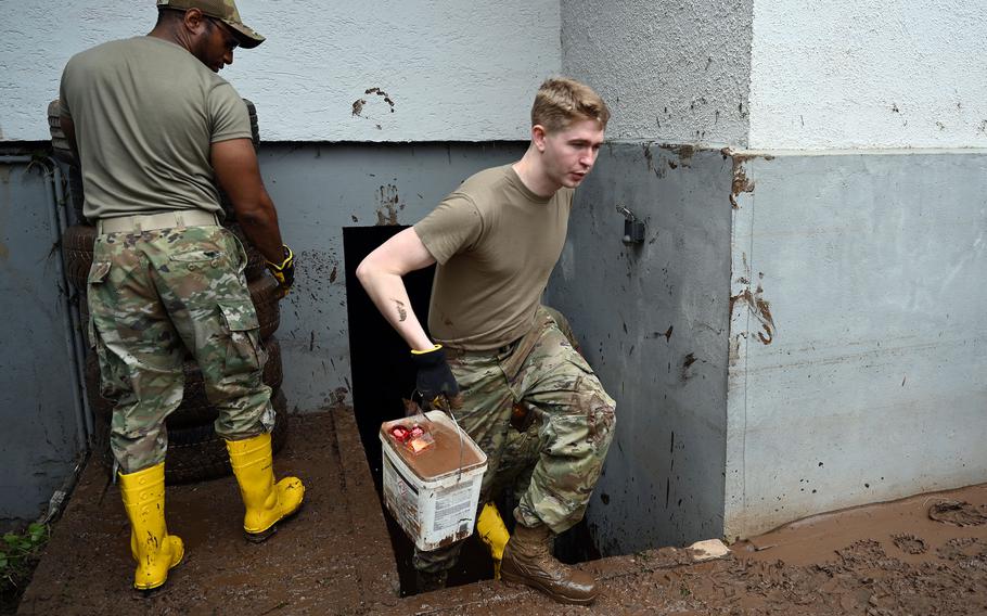 U.S. airmen from the 52nd Fighter Wing at Spangdahlem Air Base, Germany, aid flood disaster recovery efforts in Auw an der Kyll, Germany, July 16, 2021. Flash flooding last week inundated homes and caused scores of deaths in parts of western Germany and Belgium.