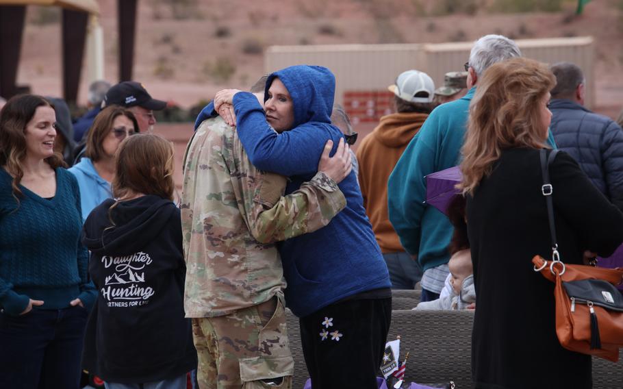 More than 150 service members of the 856th Military Police Company from the Arizona Army National Guard rally together with their families on Bushmaster Field in Phoenix, Ariz., for an send-off ceremony Sunday, Jan. 21, 2024. 