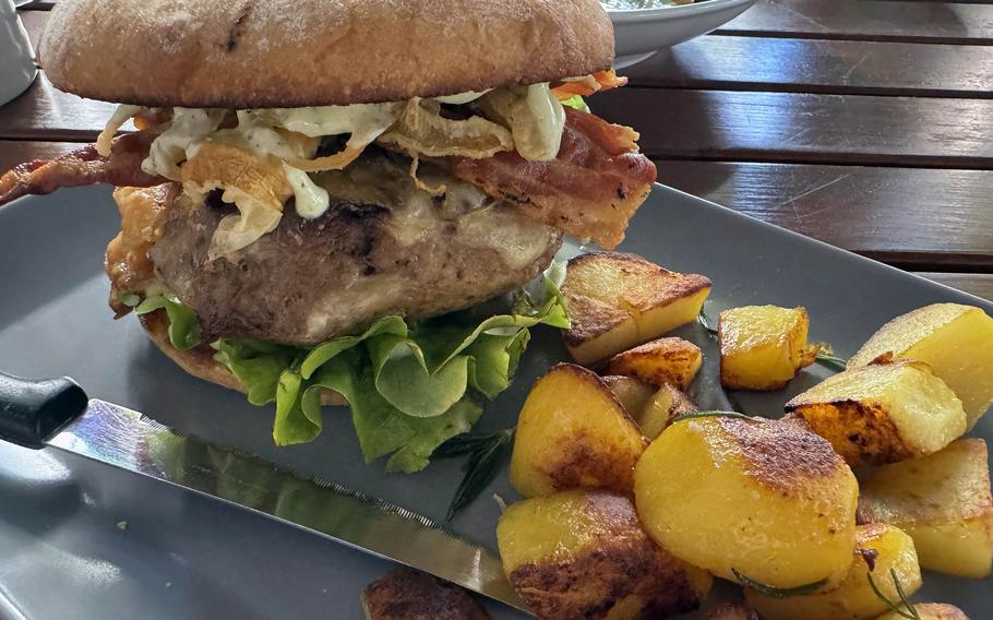 A cheeseburger and fried potatoes as served at a Mainz, Germany restaurant.