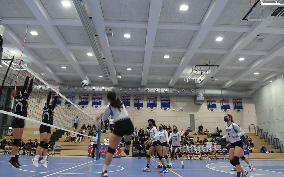 Wiesbaden senior middle hitter Antonia Welch tries to hit the ball over a pair of Stuttgart defenders inthe DODEA-Europe Division I girls’ volleyball championships on Saturday, Oct. 30, 2021, at Ramstein High School in Germany. The Panthers beat Wiesbaden in five sets to win the championship.