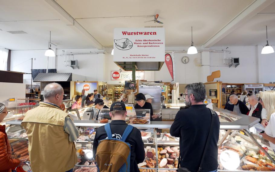 People shop in the Hoechst market hall in Frankfurt. It is open Tuesday, Friday and Saturday, like the outdoor farmers market that takes place in front of it. Market days are a good time to visit Hoechst.