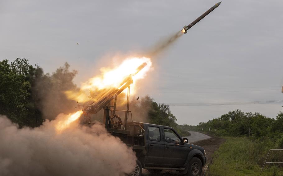 Soldiers with the 24th Separate Assault Battalion fire a modified missile launch rocket system toward Russian positions in Bakhmut on May 26, 2023. 