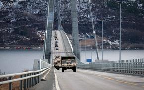 U.S. soldiers from the 10th Mountain Division's 3rd Brigade send a convoy from Narvik, Norway, to Evenes, Norway, on April 26, 2024. The unit was transporting vehicles and equipment in Norway, where it began a long-distance road march Tuesday that will take soldiers through Sweden and on to Finland.