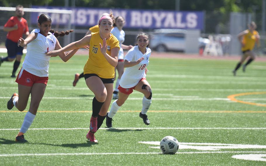 Stuttgart's Madeleine Fleming outruns Lakenheath's Anabella Potenzone, left, and Katerina Vargas on a breakaway Monday, May 19, 2025, at the DODEA-Europe Division I girls soccer championships at Ramstein Air Base, Germany.