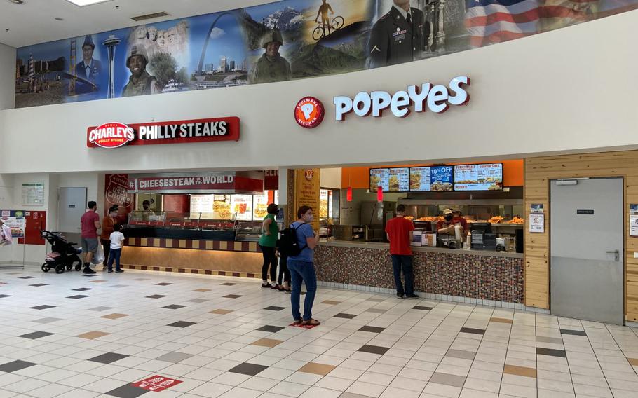 People wear masks at the food court at U.S. Army Garrison Stuttgart, Germany, on Sept. 29, 2020.  Masks are again required in all common areas at the Army’s garrison.