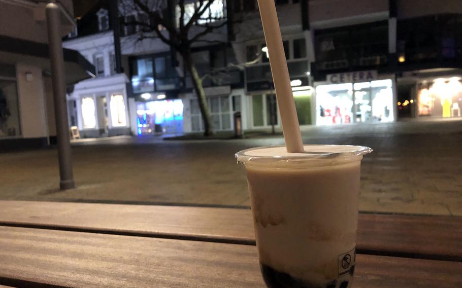 A bubble tea from Babe's Boba Tea, with the cafe in the background, at Schillerplatz in Kaiserslautern, Germany.