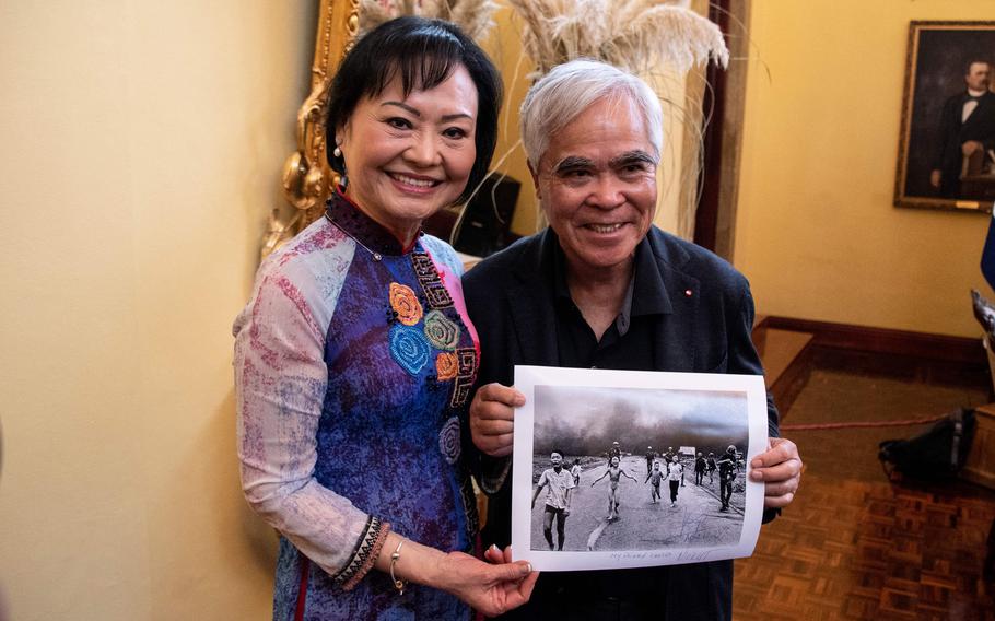 The survivor of the Vietnam War, Kim Phuc Phan Thi, on the left, also known as the 