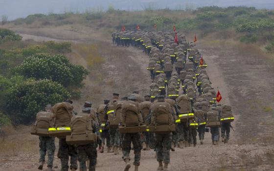 Marines from Bravo Company, MCRD on on their last phase of the crucible, make their way down from the reaper during the 3-day crucible event at Camp Pendleton.
