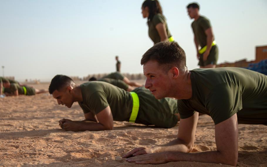 U.S. Marines hold a plank during Corporals Course physical training in Saudi Arabia, June 6, 2021. The Corps is doing away with crunches as part of its fitness test and replacing them with planks.