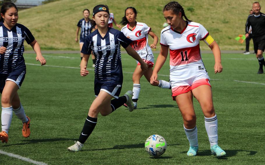 E.J. King’s Maliwan Schinker looks to move upfield against Sacred Heart during Monday’s girls Division II soccer matches. The Symbas and Cobras tied 1-1. Schinnker leads the Pacific with 46 goals.