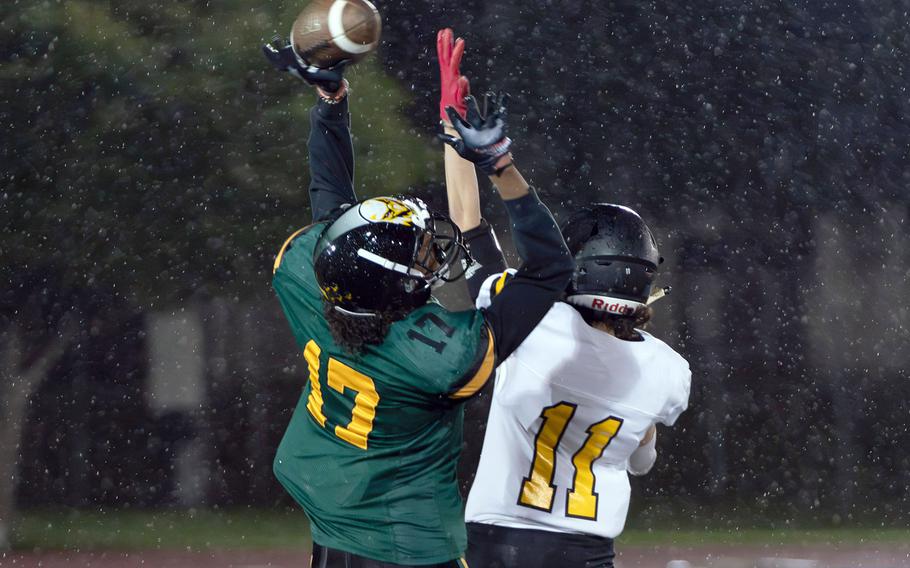 Robert D. Edgren's Carlos Alomar and American School In Japan's Hayden Thomas go up for the ball.