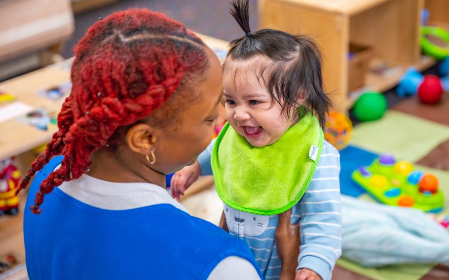 A worker from the Malmstrom Child Development Center holds a child, Sept. 8, 2022, at Malmstrom Air Force Base, Mont. The CDC’s infant program is designed for children six weeks to 12 months. The CDC provides care to children of active-duty military and DoD/NAF civilian personnel families.