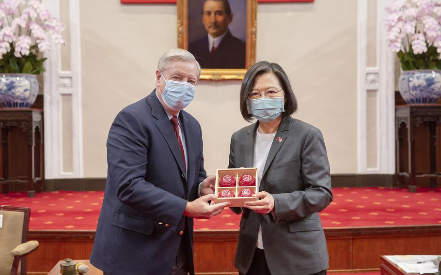 Sen. Lindsey Graham, R-S.C., left, and Taiwan’s President Tsai Ing-wen, right, pose for a photo during a meeting at the Presidential Office in Taipei, Taiwan, Friday, April 15, 2022. 
