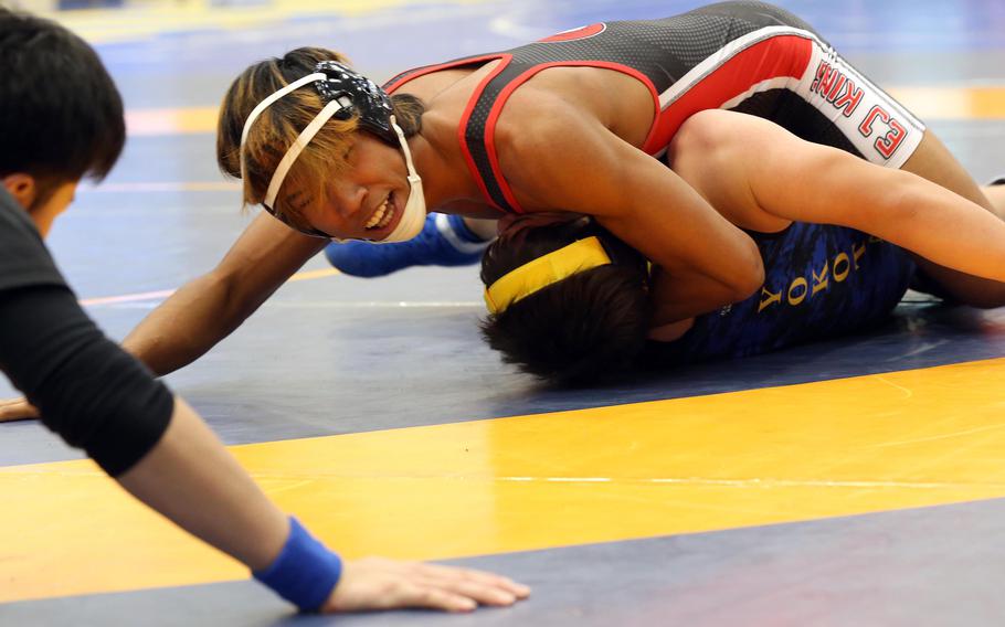 E.J. King's Soraat Johdee pins Yokota's Laine Lilly in the 152-pound final during Saturday's Yokota wrestling tournament.
