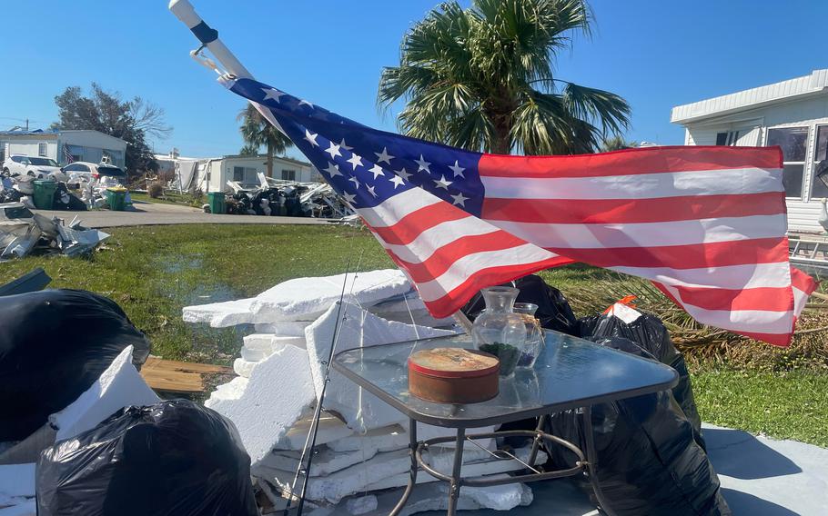 An American flag flies amid the devastation left by Hurricane Ian in Englewood, Fla.