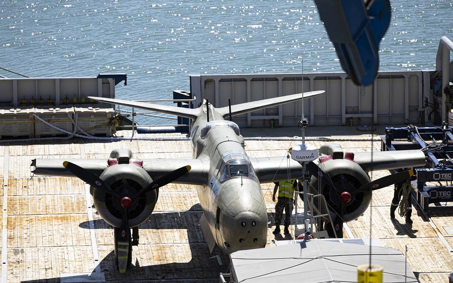 A Douglas A-20 Havoc bomber is loaded onto the ADV Reliant.