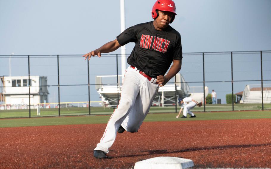 Kinnick's Arashi Blocton rounds third base.