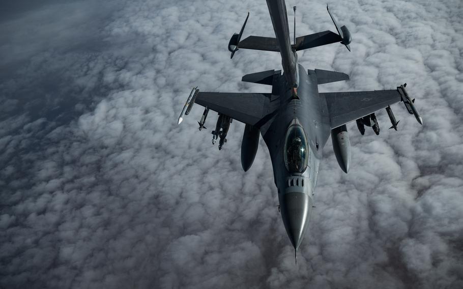An Air Force KC-10 Extender conducts aerial refueling with an F-16 Fighting Falcon in the U.S. Central Command area of responsibility in December 2020. The F-16 is a compact, multirole fighter aircraft.