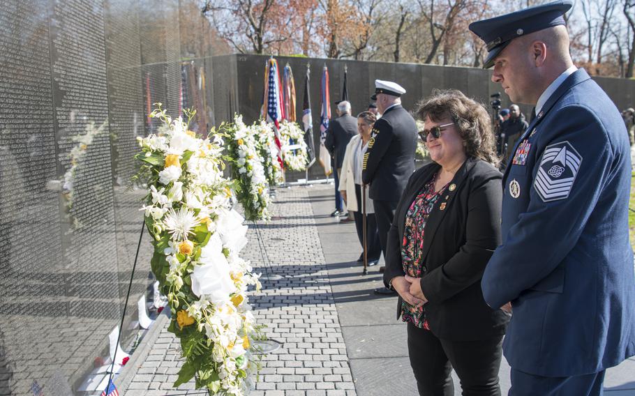 Jeanette Chervony and Chief Master Sgt. Kyle Mullen, a member of the Space Force, attend a wreath laying ceremony at the Vietnam Veterans Memorial in Washington, D.C., on Wednesday, March 29, 2023, to commemorate National Vietnam War Veterans Day.