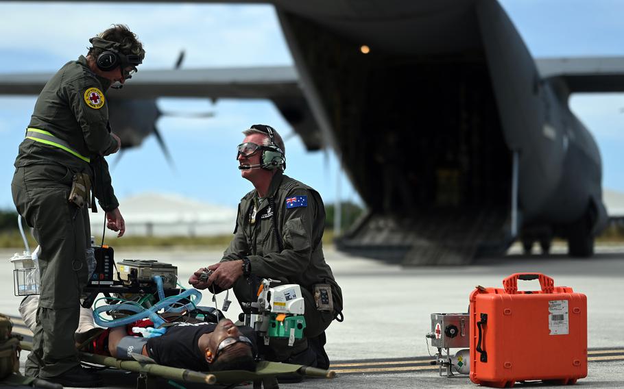 Royal Australian Air Force medical officers treat a simulated patient during a mass casualty scenario as part of Cope North 24 at Andersen Air Force Base, Guam, Feb. 11, 2024.