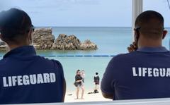 Lifeguards keep an eye on people visiting Araha Beach in Chatan, Okinawa, Thursday, May 19, 2022. 
