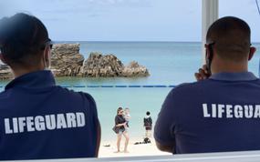 Lifeguards keep an eye on people visiting Araha Beach in Chatan, Okinawa, Thursday, May 19, 2022. 